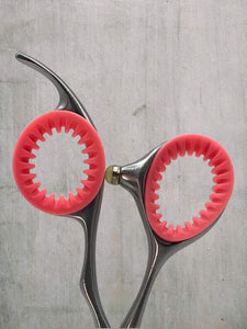 Coral Pink ShearRings inside a pair of haircutting shears