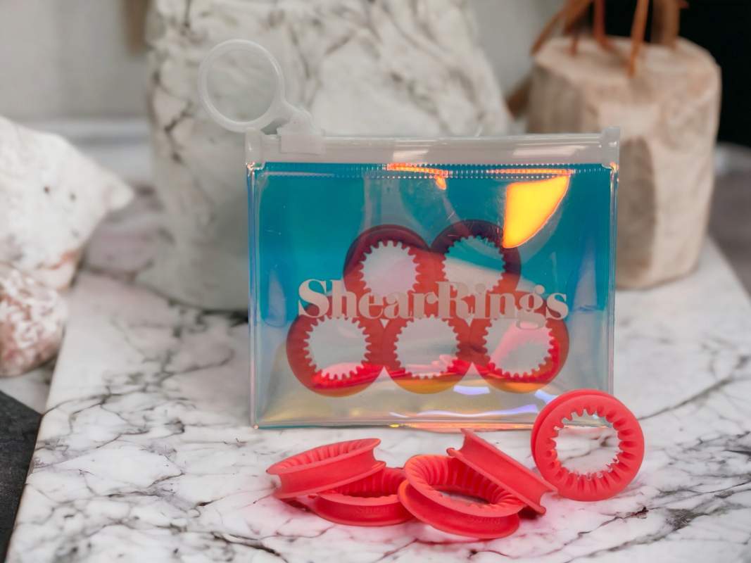 Coral Pink ShearRings in iridescent packaging, and 5 rings displayed in front